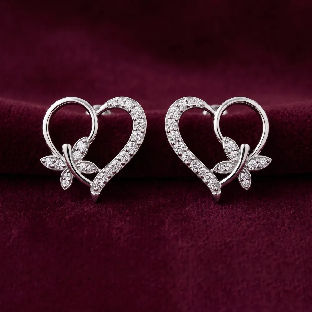 Eternal Bloom heart studs in 925 silver, on burgundy velvet
